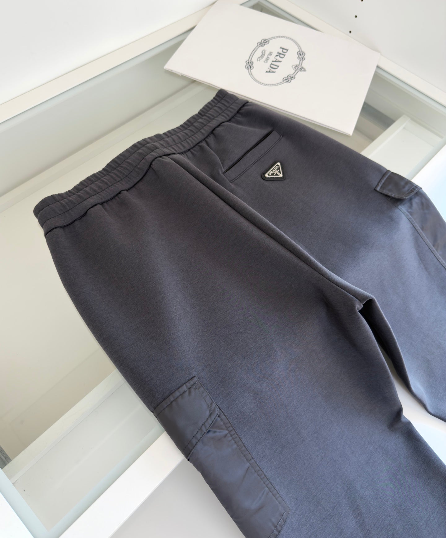PRADA COTTON FLEECE JOGGERS WITH RE-NYLON DETAILS GREY PANTS