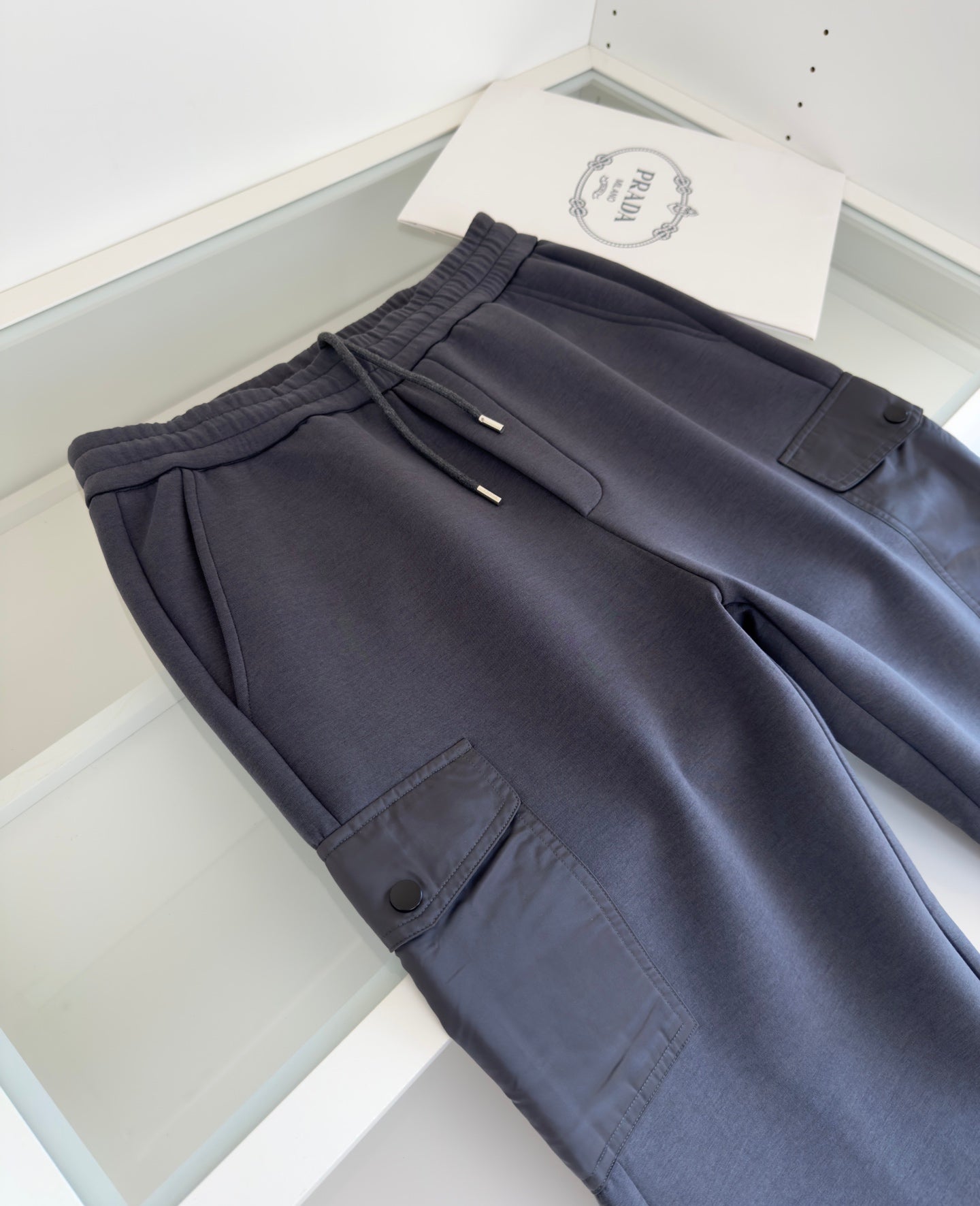 PRADA COTTON FLEECE JOGGERS WITH RE-NYLON DETAILS GREY PANTS